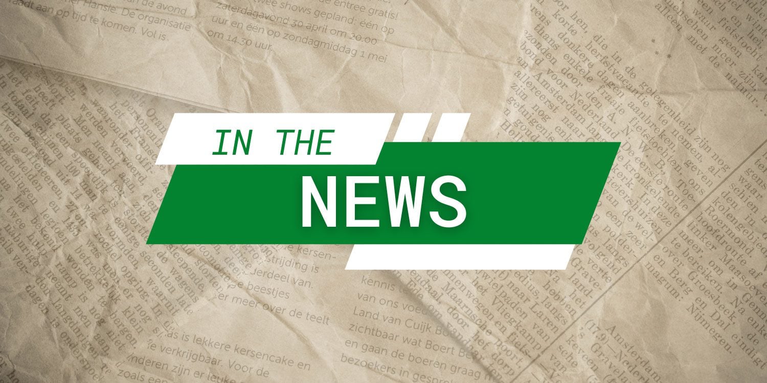 Green and white graphic with "IN THE NEWS" over newspaper.